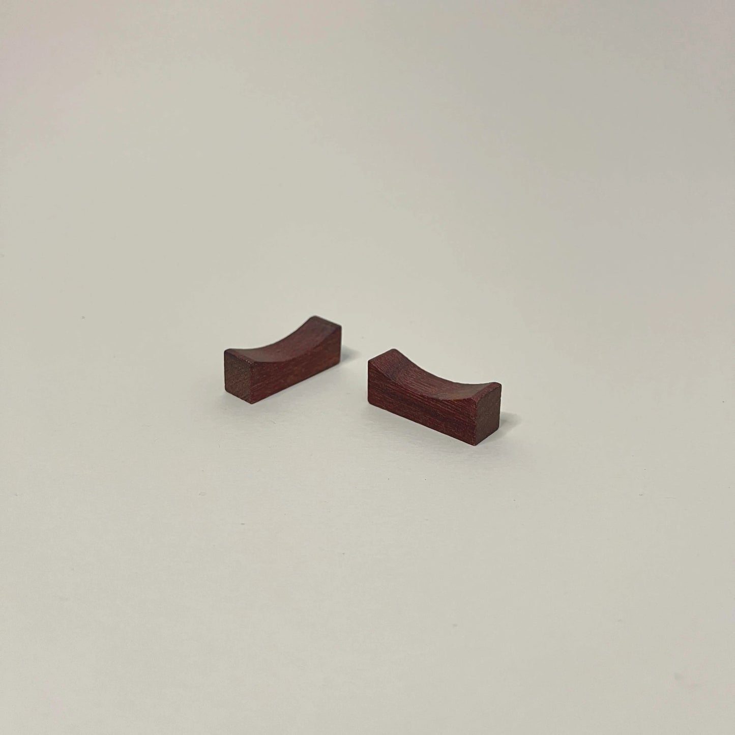 Two wooden blocks on a beige background