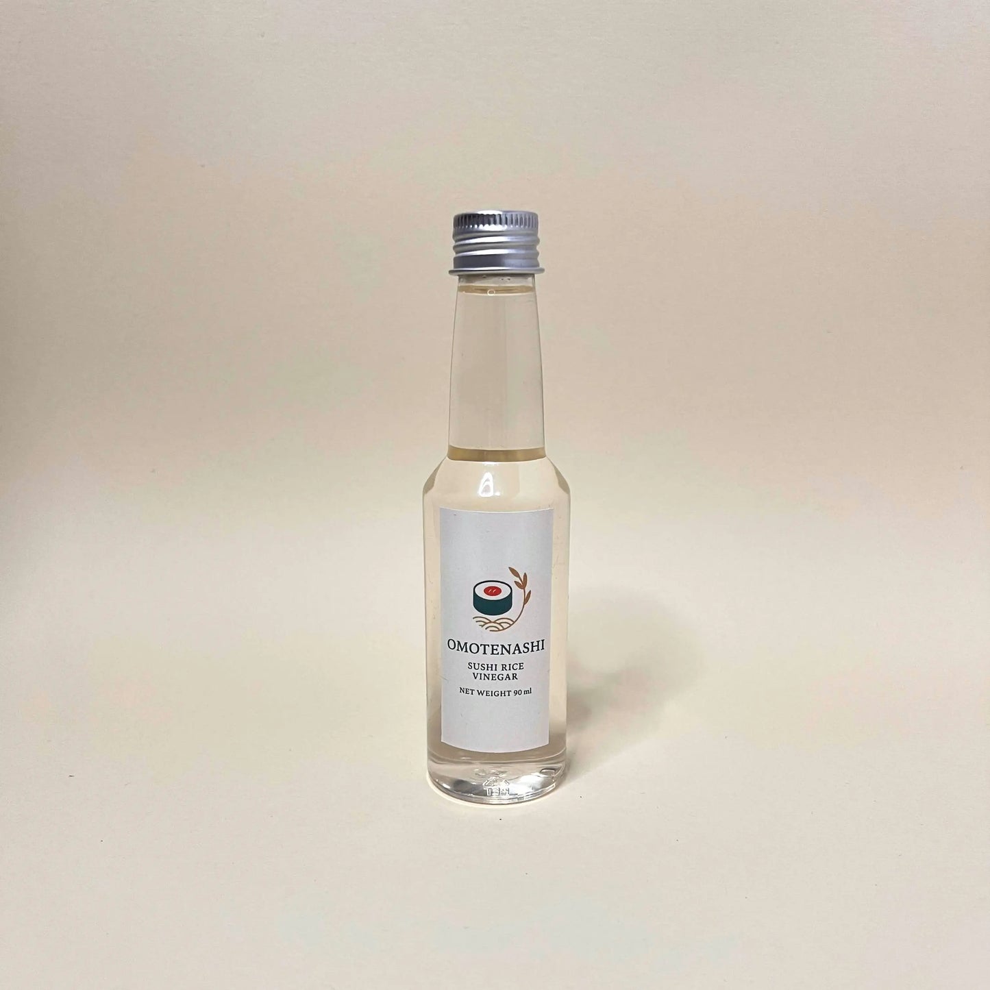 Small bottle of Omotenashi Rice Vinegar on a light background
